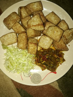 A picture of Fried tofu with chicken sauce.