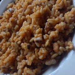 A picture of Jollof rice and beans.