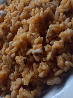 A picture of Jollof rice and beans.