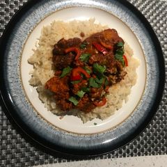 A picture of Tandoori Chicken with butter rice.