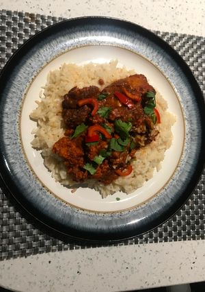A picture of Tandoori Chicken with butter rice.
