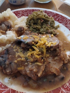 A picture of Smothered Pork Chops GF DF.