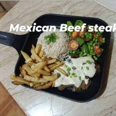 A picture of Beef Mexican steak with colorful veggies 🥬🥕🥑🌶️.