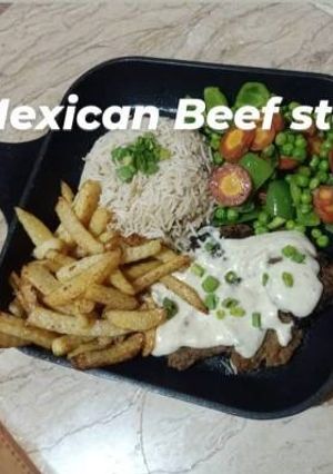 A picture of Beef Mexican steak with colorful veggies 🥬🥕🥑🌶️.