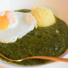 A picture of Spinach Sauce with mashed potato and fried egg.