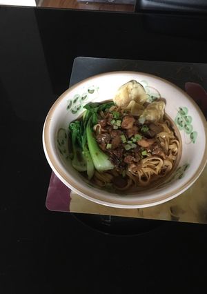 A picture of Chicken mushroom noodle with wonton.