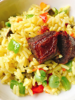 A picture of Fried rice and fried beef.