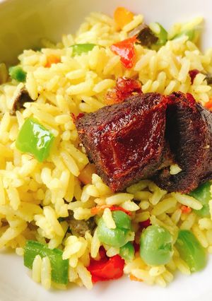 A picture of Fried rice and fried beef.