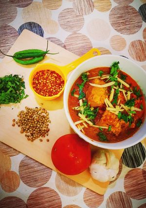 A picture of Dhaba Koyla Karahi & Naans.