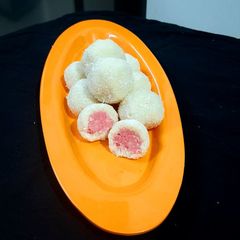 A picture of Stuffed Coconut Laddu.