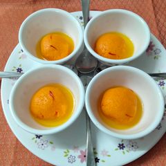 A picture of Orange flavoured Rasgulla.