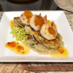 A picture of Grilled halibut and shrimp kumquat chutney, shaved Brussels sprouts,And quinoa.