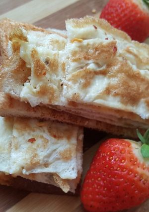 A picture of Fried Egg on Toast With Strawberries.