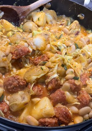 A picture of Chorizo, potatoes, beans, courgette and cabbage.
