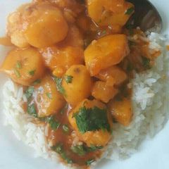 A picture of Stewed bananas served with rice.