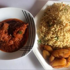 Stir fried rice, chicken stew and fried plantain A picture of Stir fried rice, chicken stew and fried plantain.
