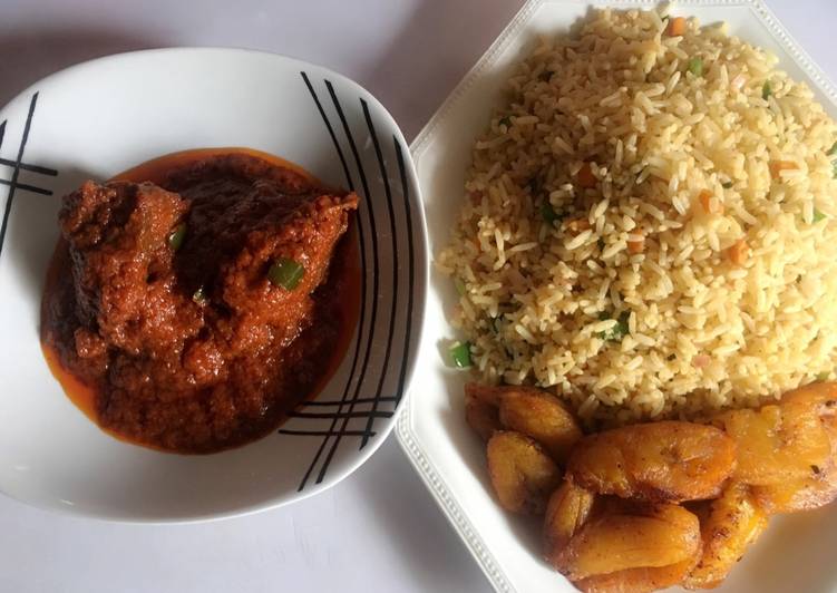 Stir fried rice, chicken stew and fried plantain