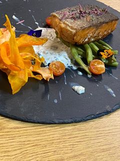 A picture of Salmon Marinated in Grape Oil with Caper Sauce.