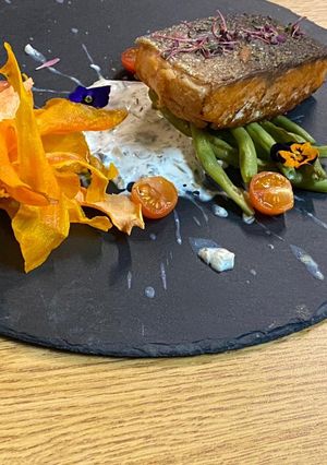 A picture of Salmon Marinated in Grape Oil with Caper Sauce.