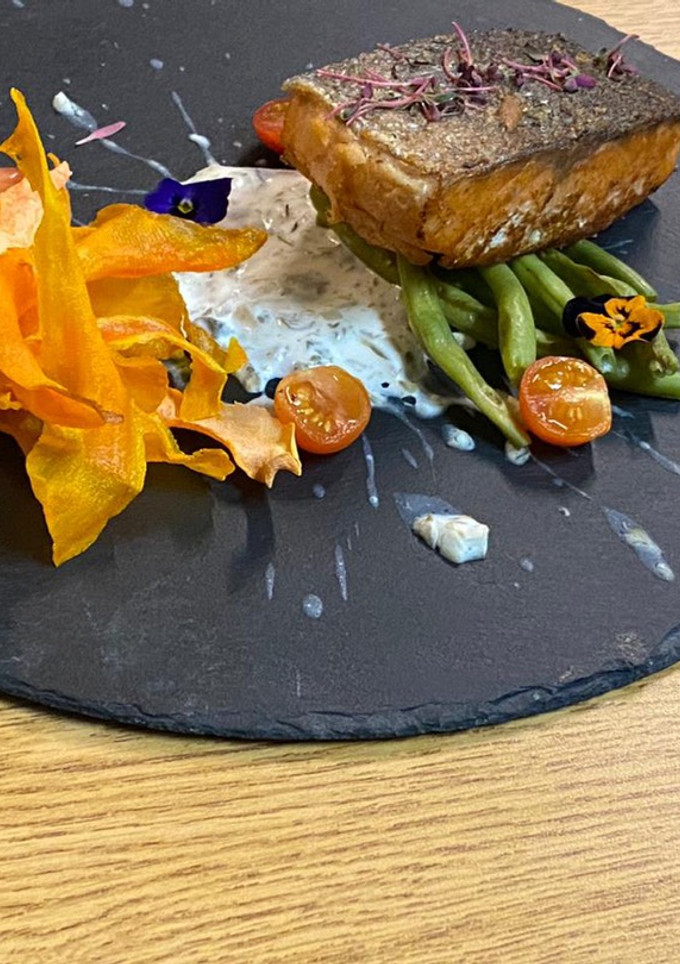 A picture of Salmon Marinated in Grape Oil with Caper Sauce.