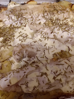 Una foto de Merluza al horno con papas a la crema