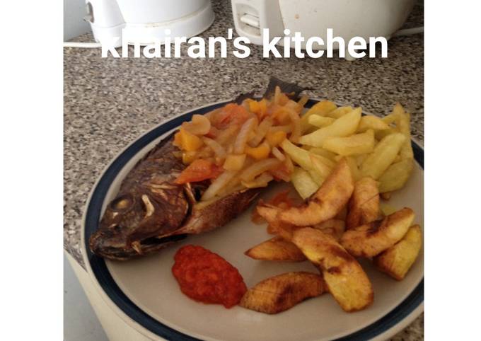 Chips,plantain and grilled tilapia fish
