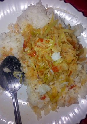 A picture of Rice with fried cabbages.