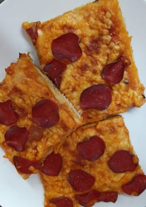 Una foto de Pizza: hawaiana y pepperoni