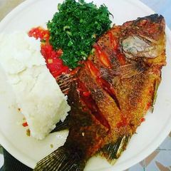 A picture of Fried Fish, Kales with Ugali.