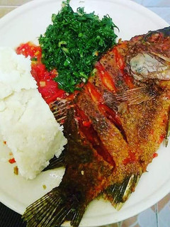 A picture of Fried Fish, Kales with Ugali.