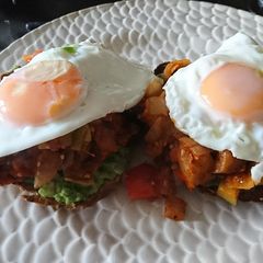 A picture of Fried Eggs on Ratatouille on spicy Avocado on Sourdough...
