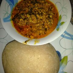A picture of Eba and egusi soup.
