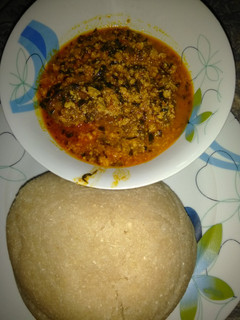 A picture of Eba and egusi soup.