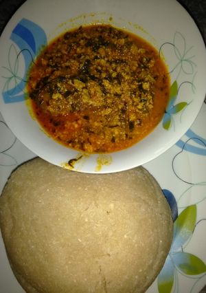 A picture of Eba and egusi soup.