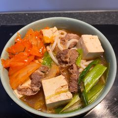 A picture of Kimchi Udon Soup.