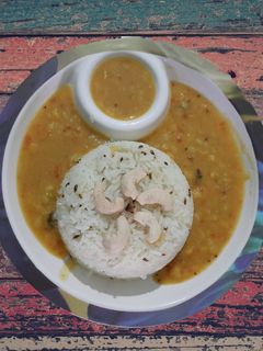 A picture of Dal fry and jeera rice.