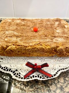 Una foto de Coca de Llanda rellena con manzanas