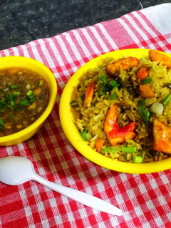 A picture of Hot and Sour Chicken Soup with Chicken fried rice.
