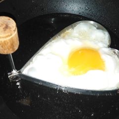 A picture of Half fried egg.