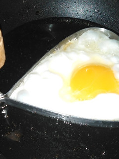 A picture of Half fried egg.