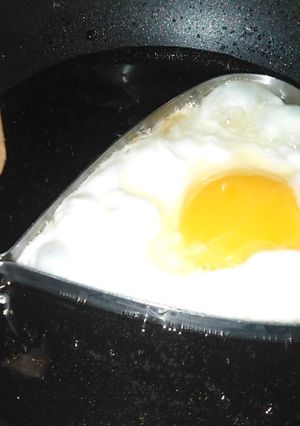 A picture of Half fried egg.