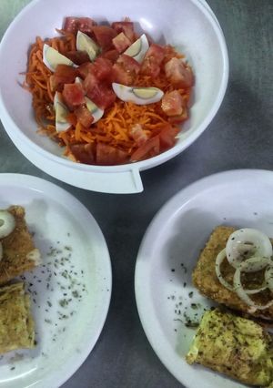 Una foto de Milanesas de queso con anillos de cebolla