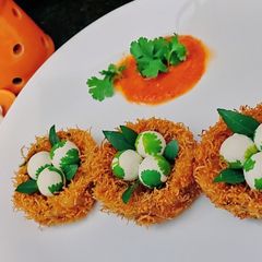 A picture of Potato fritters with paneer ball.