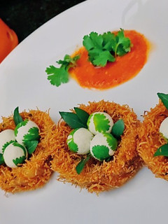 A picture of Potato fritters with paneer ball.