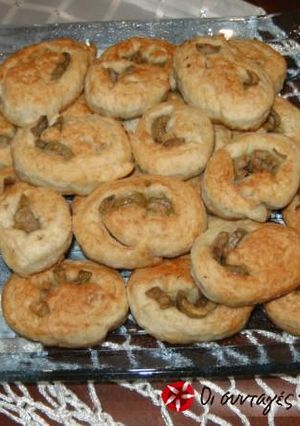 A picture of Mini olive pies in the frying pan.