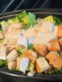 A picture of Chicken Caesar Salad - meal prep/weekly lunch grab n’ go!.