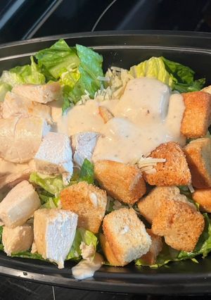 A picture of Chicken Caesar Salad - meal prep/weekly lunch grab n’ go!.