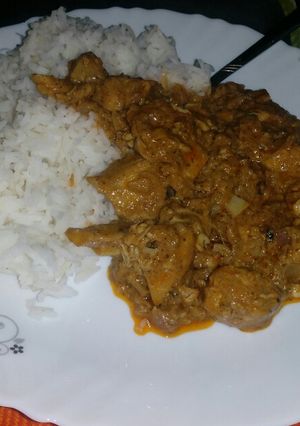 A picture of Chicken tikka masala with rice.