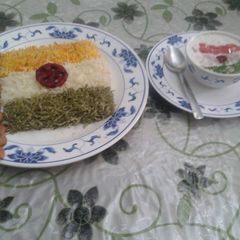 A picture of Tri colour rice and raita.