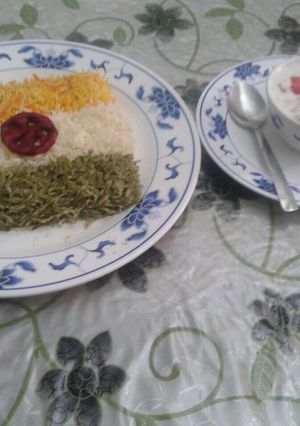 A picture of Tri colour rice and raita.